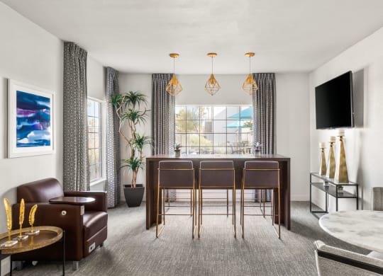 a living room filled with furniture and a large window